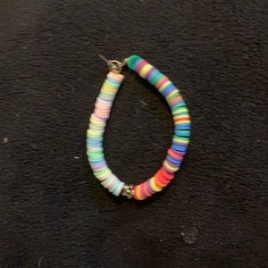 Pastel rainbow and bright rainbow with flower charm in middle clay bead